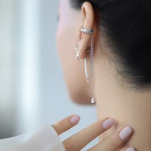 Close-up of 925 sterling silver tassel ear cuff with water-drop zircon detail