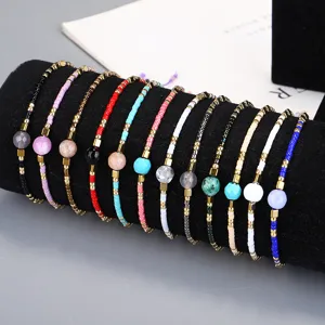Selection of colorful bohemian Miyuki seed bead bracelets with central semi-precious stones