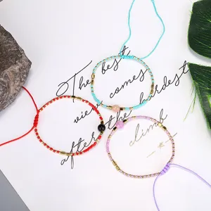 Close-up of bohemian Miyuki bead woven bracelets with semi-precious stone accents