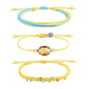 Set aus drei böhmischen gewebten Armbändern in Gelb mit Perlen und Glas