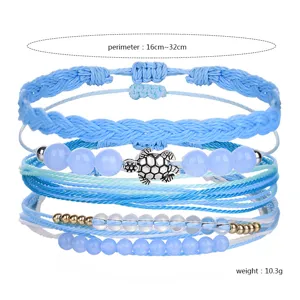 Adjustable blue woven beach bracelet set with silver sea turtle and crystal beads