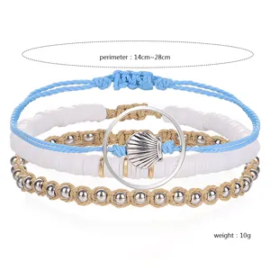 Detailed view of a boho wax rope bracelet set with shell and clay beads.