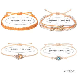 Detailansicht von vier handgefertigten Wachskordel-Armbändern mit Hamsa-Hand und Evil Eye
