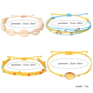 Handgefertigtes Wachskordel-Armbandset mit Muschel- und Perlendetails, verstellbar 15-30 cm.