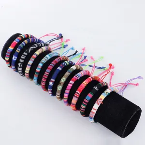 Close-up detail of colorful handmade ethnic woven cotton rope bracelets on display.