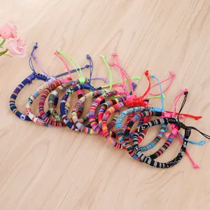 Detailed view of handmade ethnic braided bracelets with colorful geometric patterns