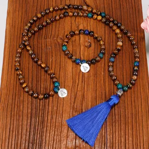 Collier Mala de 108 perles d'œil de tigre avec pompon bleu et pendentif Bouddha