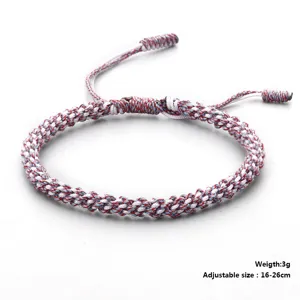 Close-up detail of handmade woven cotton bracelet with adjustable size