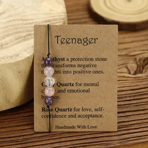 Detailed view of handmade amethyst and quartz beaded bracelet on a kraft card.
