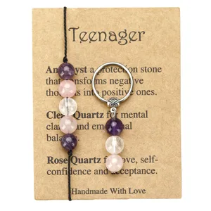 Handmade stone bead jewelry set with Amethyst and Quartz on a brown kraft display card