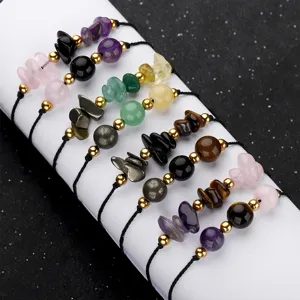 Detailed view of handmade woven stone bracelets with amethyst and copper beads