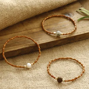 Detail of Chinese style bamboo joint bracelets with various natural stone beads