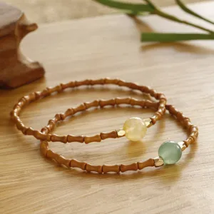 Detail view of Chinese style bamboo joint olive nut bracelet with stone beads