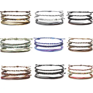 Set of handmade woven wax cord bracelets with natural stone beads in various colors