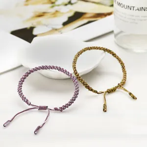 Detail view of handmade woven cotton cord bracelets with traditional corn knot design
