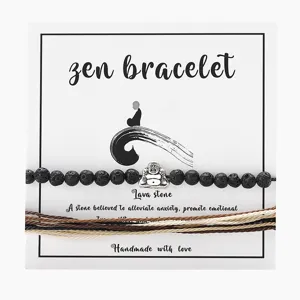Detailansicht eines Zen-Lavastein-Armband-Sets mit Buddha-Anhänger und handgefertigter Wachsschnur