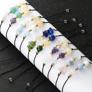 Macro detail of handmade stone bracelets with amethyst, lapis and rose quartz chips