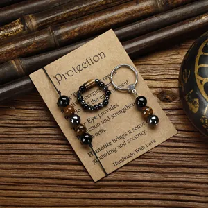 Detailed view of handmade Tiger's Eye and Hematite bead bracelet, ring, and keychain set.