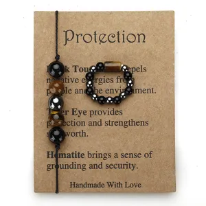 Close-up of handmade tiger eye and hematite beaded bracelet and ring gift set on card