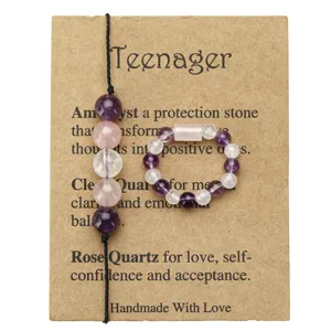 Handmade amethyst and clear quartz beaded bracelet and ring set on display card