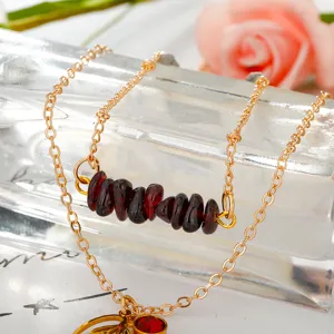 Layered stainless steel necklace with red garnet chips and snow lotus flower pendant