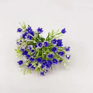 Artificial blue bell flower bouquet detail, small floral DIY accessory, close-up.