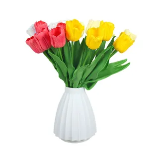 Artificial tulip bouquet fake flowers in a white ceramic vase for home decoration party