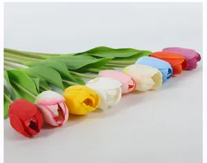 Close-up view of colorful artificial tulip flowers detail, showcasing vibrant fabric petal textures.