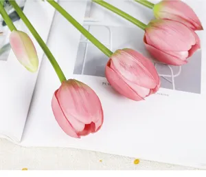Artificial tulip flower detail shot, soft PU material, pink blooms and green stem for decor.