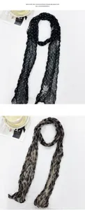 Detailed view of the wide dual-use mercerized wool scarf featuring elegant polka dot and leopard prints.