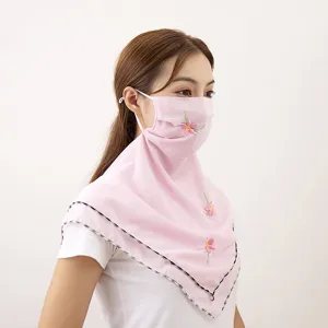 Pink chiffon sun protection face mask with delicate floral embroidery, ideal for outdoor cycling.