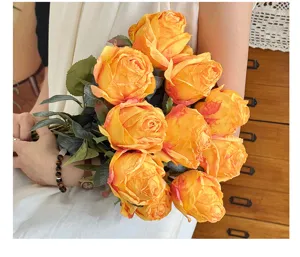 Close-up of artificial burnt edge rose bouquet, beautiful silk flower detail for home decor.