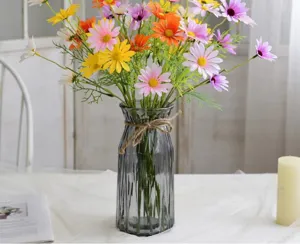 Artificial daisy flowers bouquet in glass vase home decor tabletop ornament setup