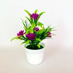 Detailed close-up of artificial purple lotus potted plant, green leaves and white pot.