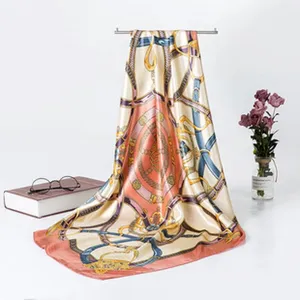 Elegant silk satin scarf featuring luxury chain and belt print design for women fashion.