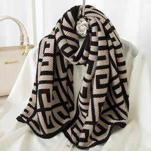 Pleated scarf with black and khaki geometric pattern, stylish autumn winter wrap.