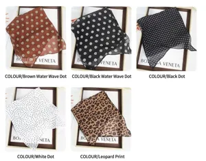 Detail view of French polka dot and leopard print silk scarves in various color options.