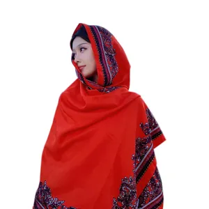 Red ethnic style shawl for women, bohemian summer beach scarf and vacation travel wrap accessory.