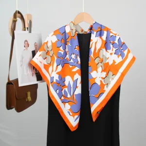 Elegant 90cm silk square scarf with vibrant orange and purple floral print french style wrap.