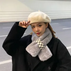 Cozy plush faux rabbit fur winter scarf and stylish beige beret fashion detail display.