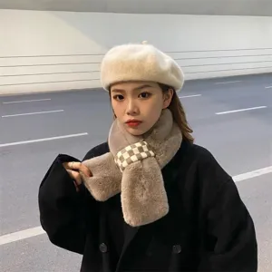 Plush faux fur scarf and beret detail view, warm winter accessory showing soft texture.