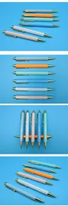 Multiple angles of colorful retractable ballpoint pens with elegant gold-tone accents