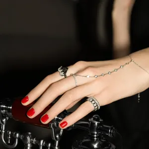 Detailed macro view of an elegant 925 sterling silver finger bracelet ring set with zircons