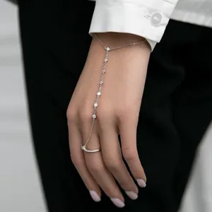 Silver 925 sterling silver finger bracelet featuring delicate CZ stones worn on a hand