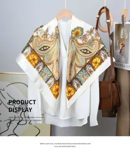 Elegant paisley print satin square scarf displayed on a white blouse with a bag.
