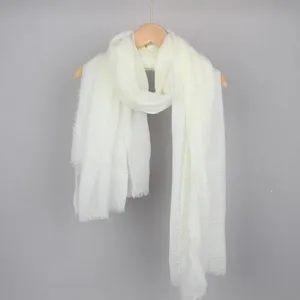 Lightweight solid white cotton linen bubble scarf with soft crinkle texture and fringe