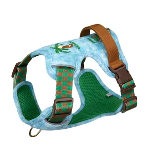 Detail of a retro denim dog harness with green checkered straps and mesh lining