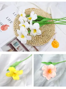 Detailed macro view of artificial PU brownie tulips in white yellow and pink colors