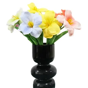 Colorful artificial PU tulips bouquet in a modern black vase for home decor