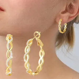 Macro view of gold-plated S925 sterling silver twisted hoop earrings with zircons